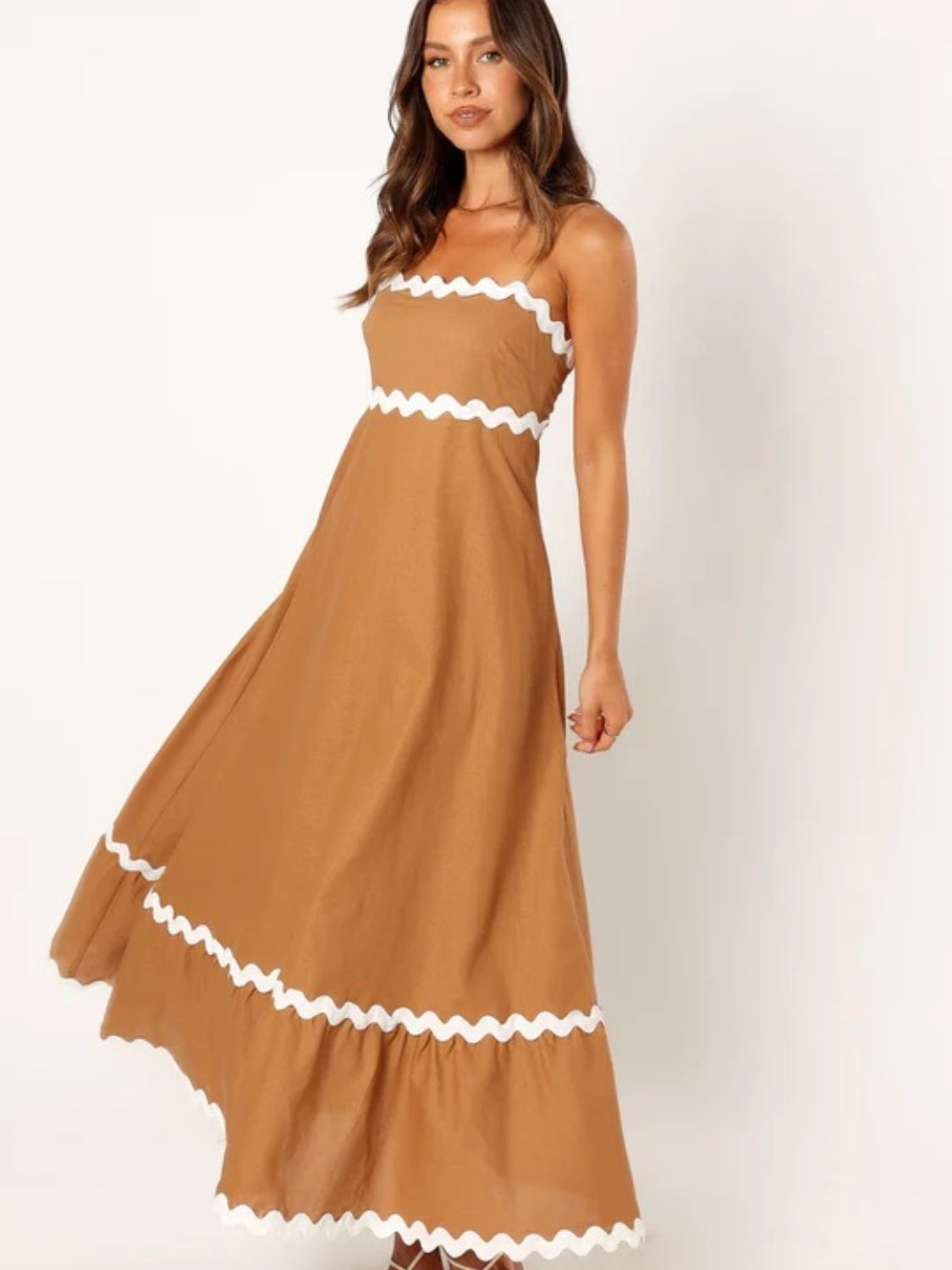 Discover chic summer style with our Spaghetti Strap Maxi Dress. Made from lightweight fabric for breathable comfort, this dress offers effortless elegance and flowy femininity. Perfect for any occasion, from beach days to brunch dates. Shop now for versatile summer style!