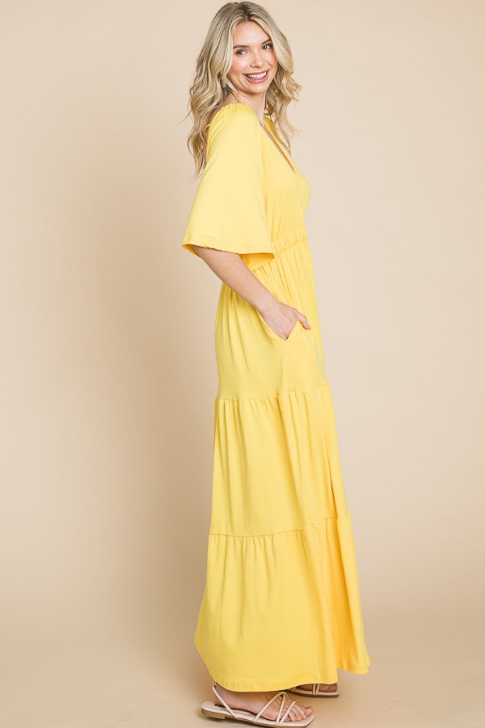 Backless Plunge Half Sleeve Tiered Dress - A stunning dress with a backless design, plunging neckline, and tiered skirt for an elegant and feminine look.