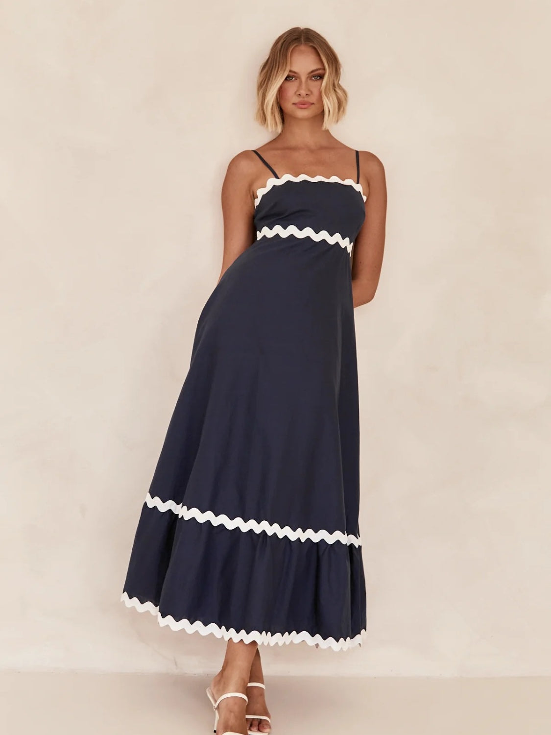 Discover chic summer style with our Spaghetti Strap Maxi Dress. Made from lightweight fabric for breathable comfort, this dress offers effortless elegance and flowy femininity. Perfect for any occasion, from beach days to brunch dates. Shop now for versatile summer style!