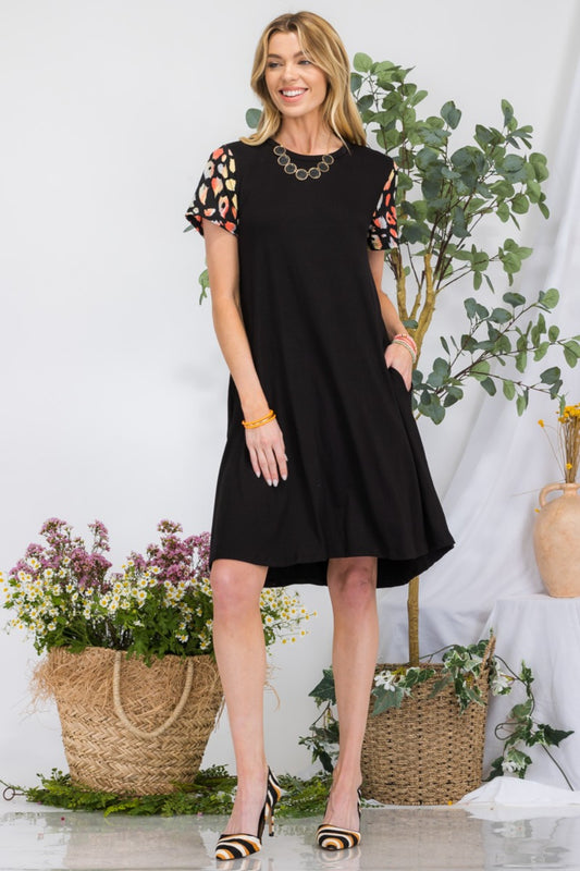 Leopard Short Sleeve Dress with Pockets - Front View: Effortlessly chic with a subtle leopard print design and convenient pockets.