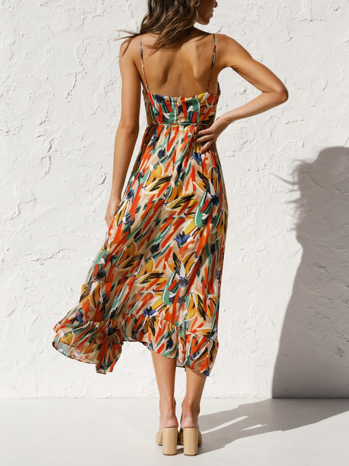 Printed Sleeveless Midi Cami Dress - Back View: Embrace summer romance with a captivating floral print and adjustable spaghetti straps.