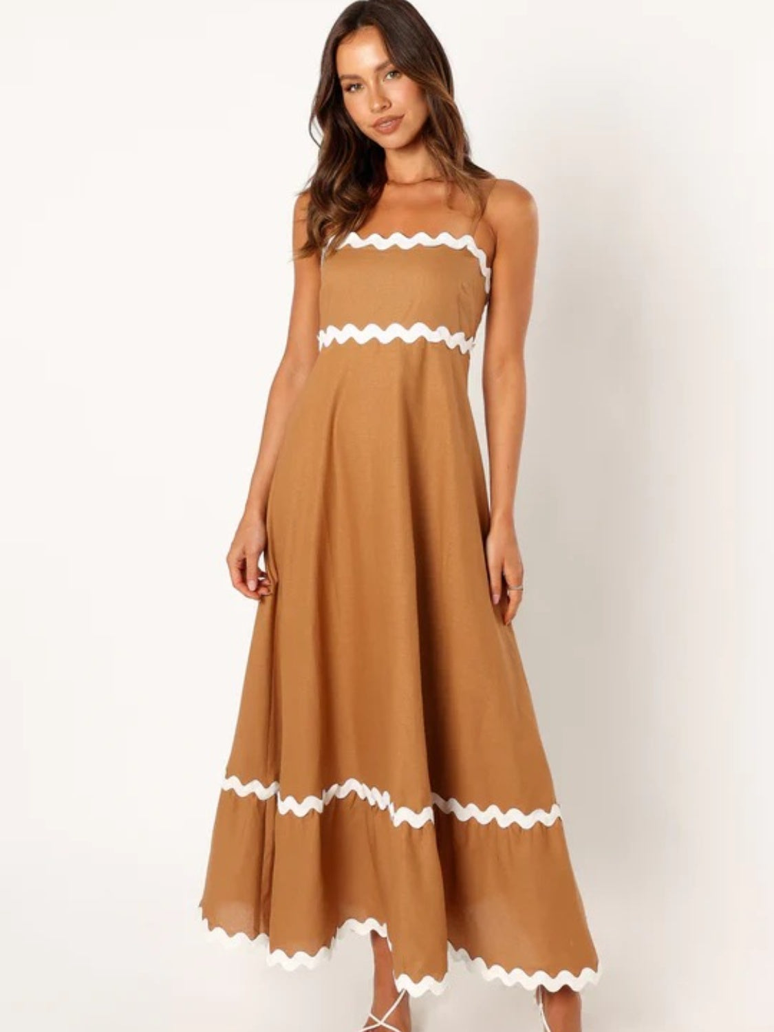 Discover chic summer style with our Spaghetti Strap Maxi Dress. Made from lightweight fabric for breathable comfort, this dress offers effortless elegance and flowy femininity. Perfect for any occasion, from beach days to brunch dates. Shop now for versatile summer style!