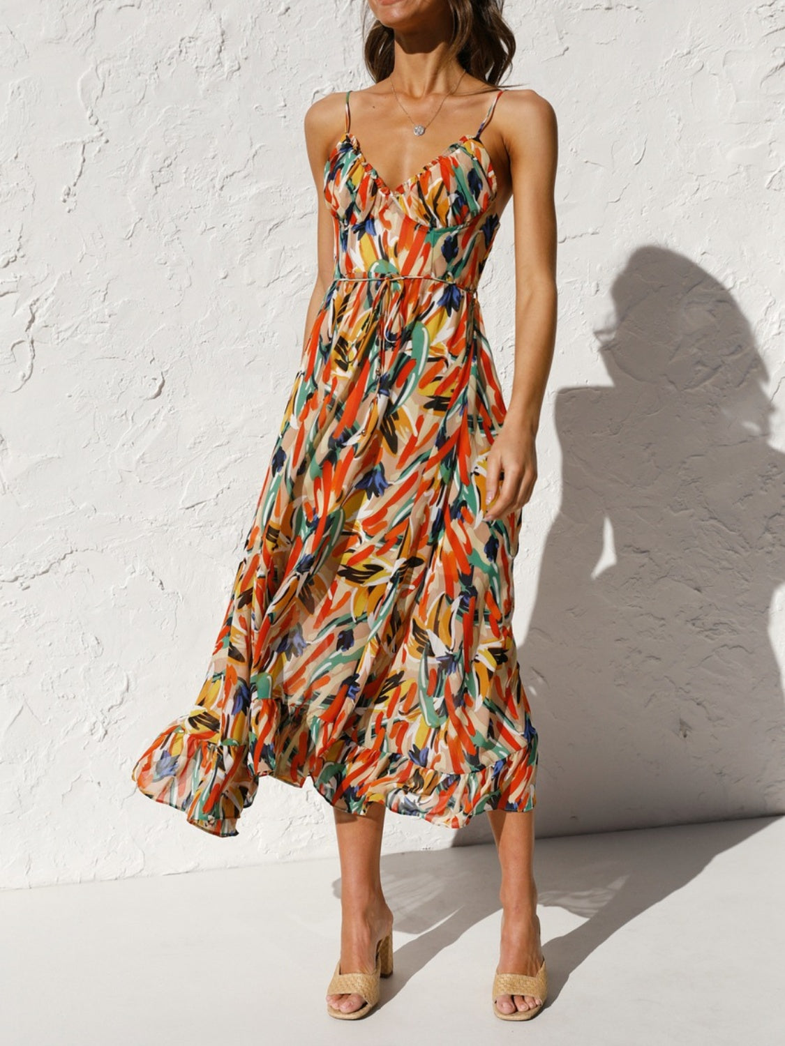 Printed Sleeveless Midi Cami Dress - Front View: Embrace summer romance with a captivating floral print and adjustable spaghetti straps.