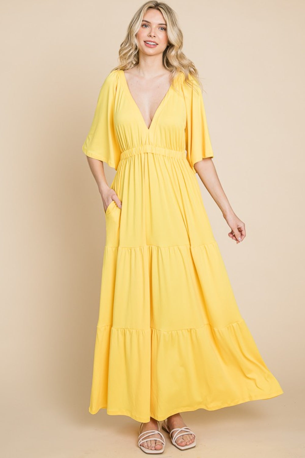 Backless Plunge Half Sleeve Tiered Dress - A stunning dress with a backless design, plunging neckline, and tiered skirt for an elegant and feminine look.